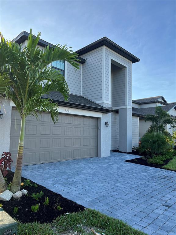 19524 Fishhawk Trail Venice, FL 34293 - Photo 5 of 30 a front view of a house with a yard