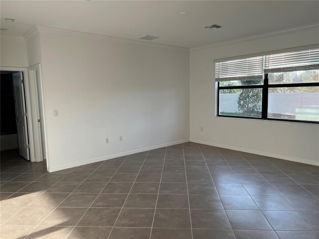 19524 Fishhawk Trail Venice, FL 34293 - Photo 9 of 30 a view of an empty room with a window