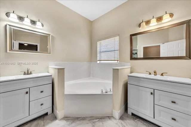 a view of an empty room with a floor to ceiling window and wooden floor