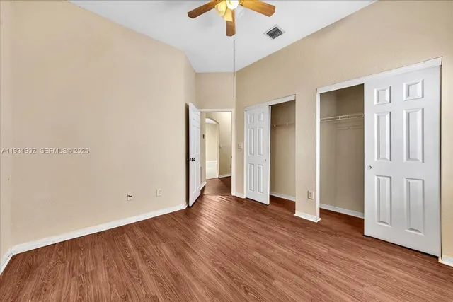 a view of a swimming pool with a bench in wooden floor