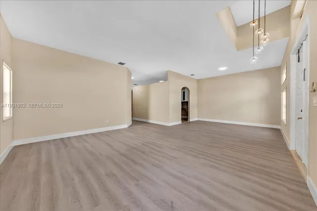 a kitchen with stainless steel appliances a refrigerator stove and microwave