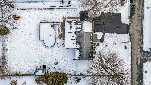 a bathroom with a shower and mirror