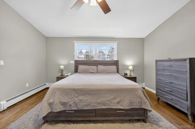 a bedroom with a bed and lamp