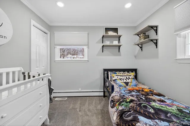 a bedroom with a bed and a table in it