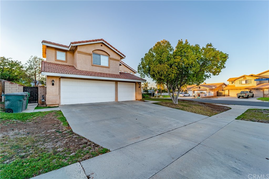 2810 Athens Circle Corona, CA 92882 - Photo 2 of 34 a front view of a house with a yard and garage