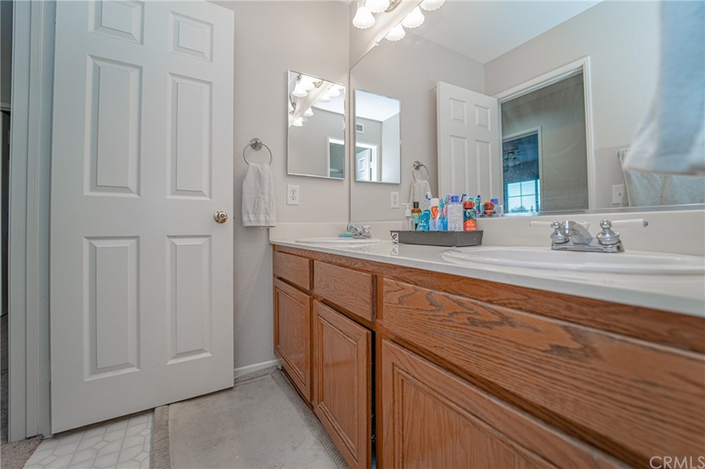 2810 Athens Circle Corona, CA 92882 - Photo 28 of 34 a bathroom with a sink and a mirror