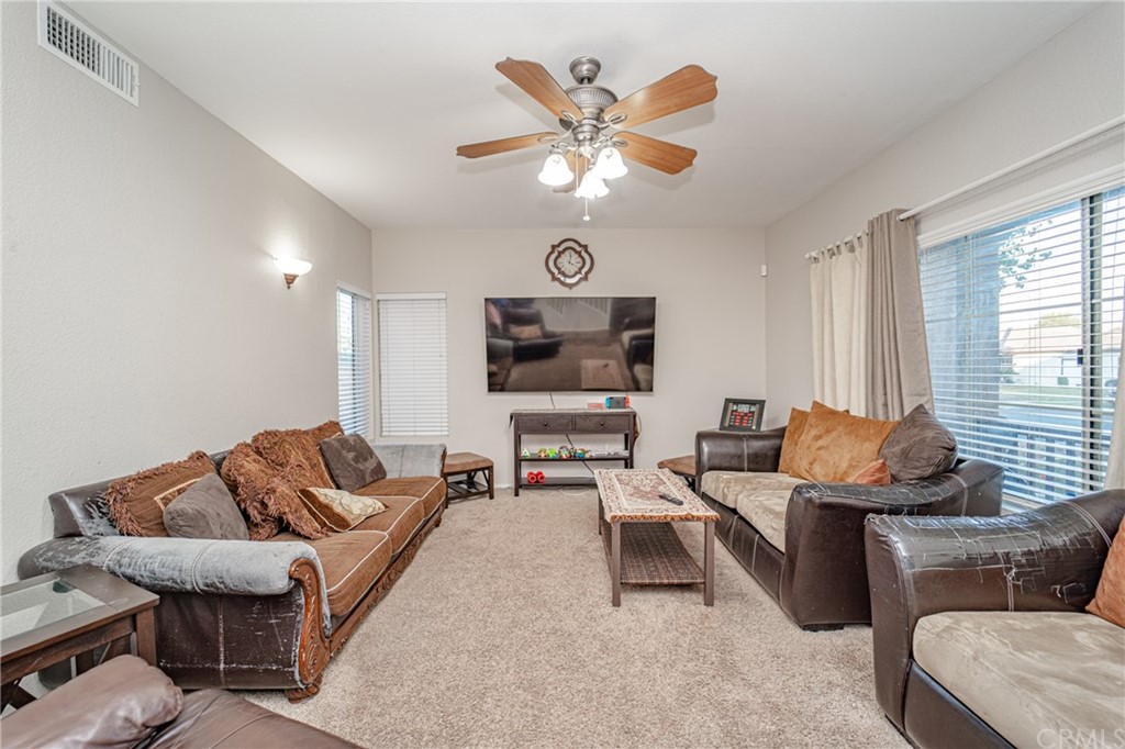 2810 Athens Circle Corona, CA 92882 - Photo 6 of 34 a living room with furniture and a flat screen tv