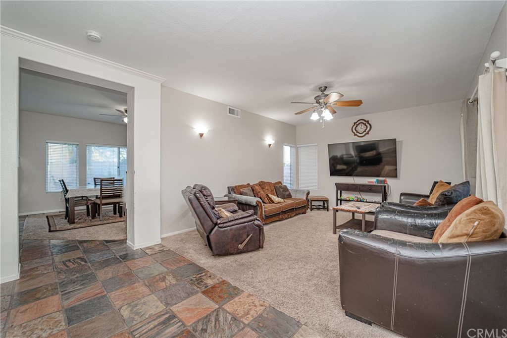 2810 Athens Circle Corona, CA 92882 - Photo 7 of 34 a living room with furniture and a flat screen tv