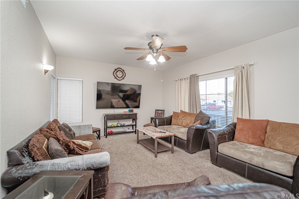 2810 Athens Circle Corona, CA 92882 - Photo 8 of 34 a living room with furniture and a flat screen tv