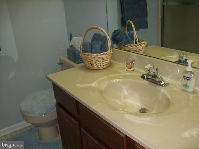 111 Cross Ridge Court Stafford, VA 22554 - Photo 16 of 23 a bathroom with a sink and a mirror
