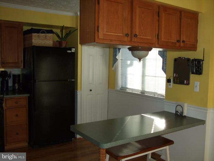 111 Cross Ridge Court Stafford, VA 22554 - Photo 3 of 23 a kitchen with stainless steel appliances granite countertop a refrigerator and a sink