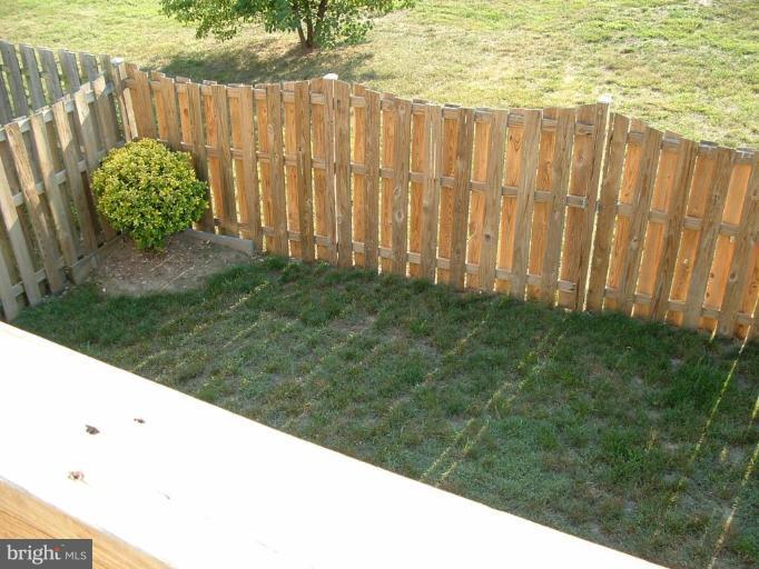 111 Cross Ridge Court Stafford, VA 22554 - Photo 22 of 23 a view of a backyard with wooden fence