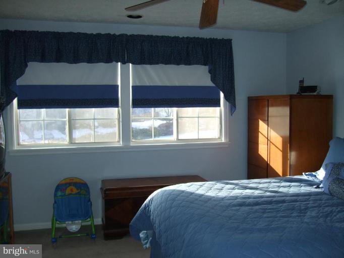 111 Cross Ridge Court Stafford, VA 22554 - Photo 10 of 23 a bedroom with a bed and window