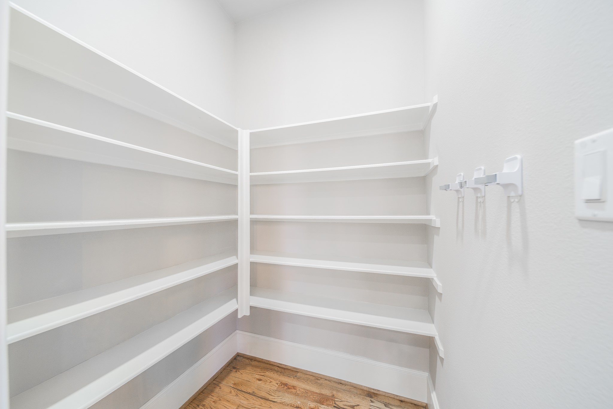 2426 Bevis Street Houston, TX 77008 - Photo 17 of 25 a view of walk in closet with empty racks