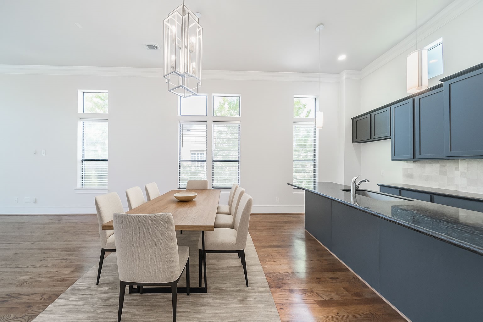 2426 Bevis Street Houston, TX 77008 - Photo 18 of 25 a view of a dining room with furniture a chandelier and wooden floor