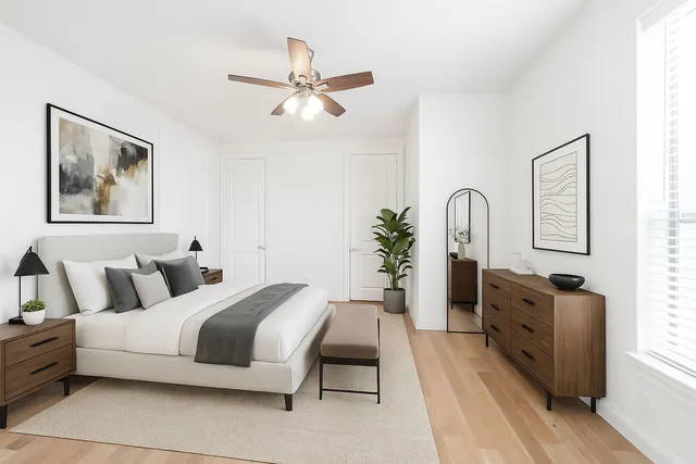 a bedroom with a bed and a dresser