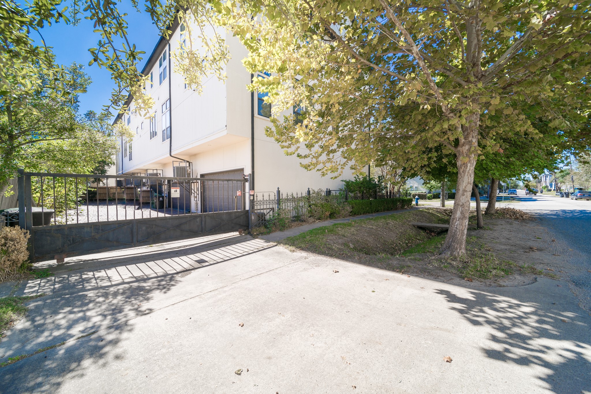 2426 Bevis Street Houston, TX 77008 - Photo 5 of 25 a view of a street with a bench and trees around