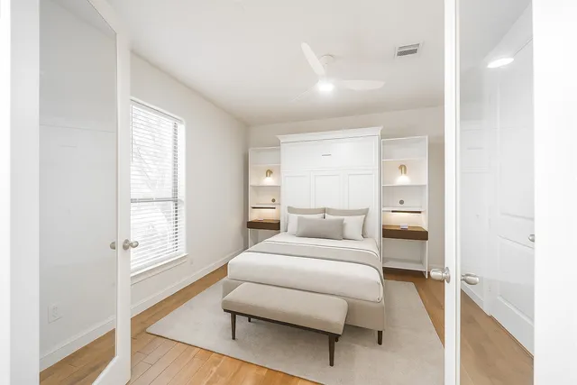 a room with a bed and a window