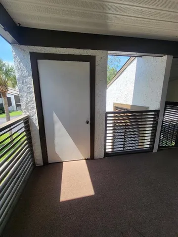 a outdoor space with furniture and a potted plant