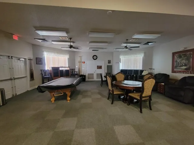 a view of a swimming pool with a yard