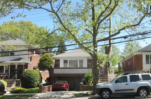 a front view of a house with parking
