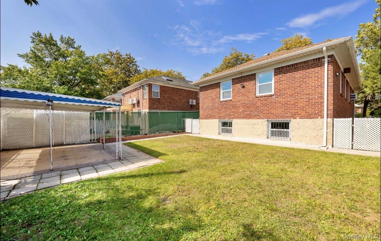 208-12 53rd Avenue Queens, NY 11364 - Photo 2 of 11 a view of a house with a yard