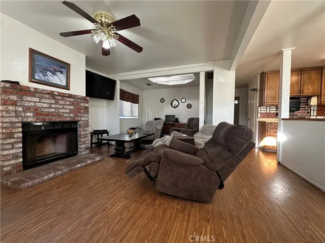 a living room with furniture fireplace and a flat screen tv