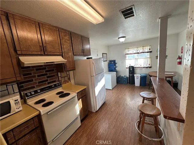 a kitchen with sink cabinets and stainless steel appliances