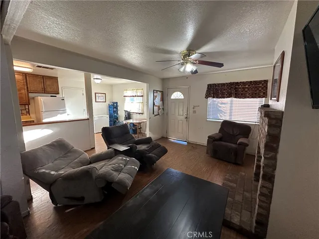 a living room with furniture rug and window