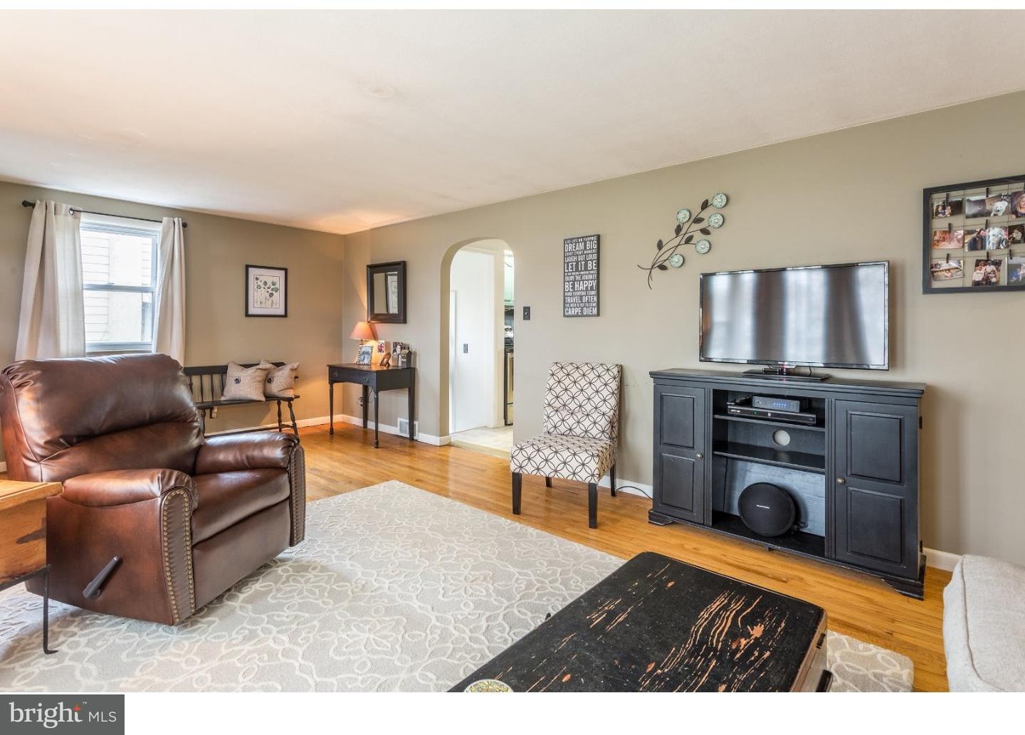 729 Fairmont Road Riegelsville, PA 18077 - Photo 2 of 10 a living room with furniture and a fireplace
