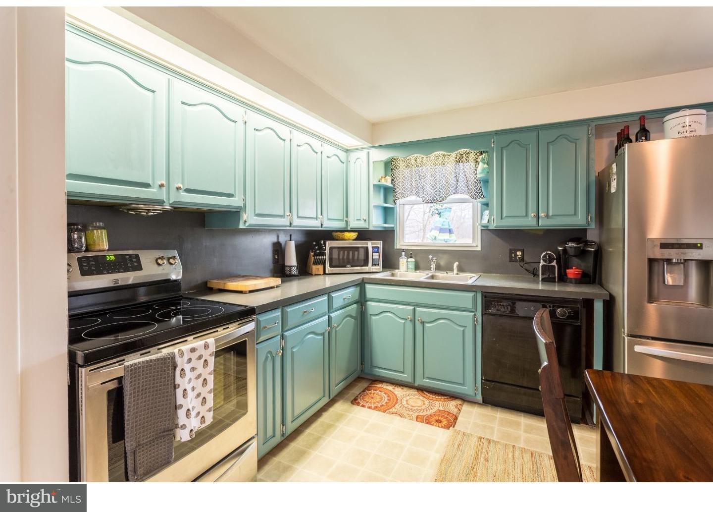 729 Fairmont Road Riegelsville, PA 18077 - Photo 6 of 10 a kitchen with stainless steel appliances granite countertop a stove a sink and a refrigerator