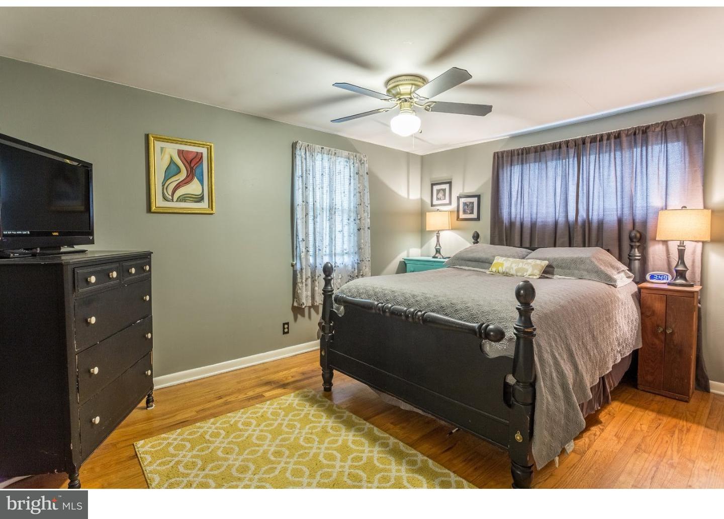 729 Fairmont Road Riegelsville, PA 18077 - Photo 7 of 10 a spacious bedroom with a bed and a flat screen tv