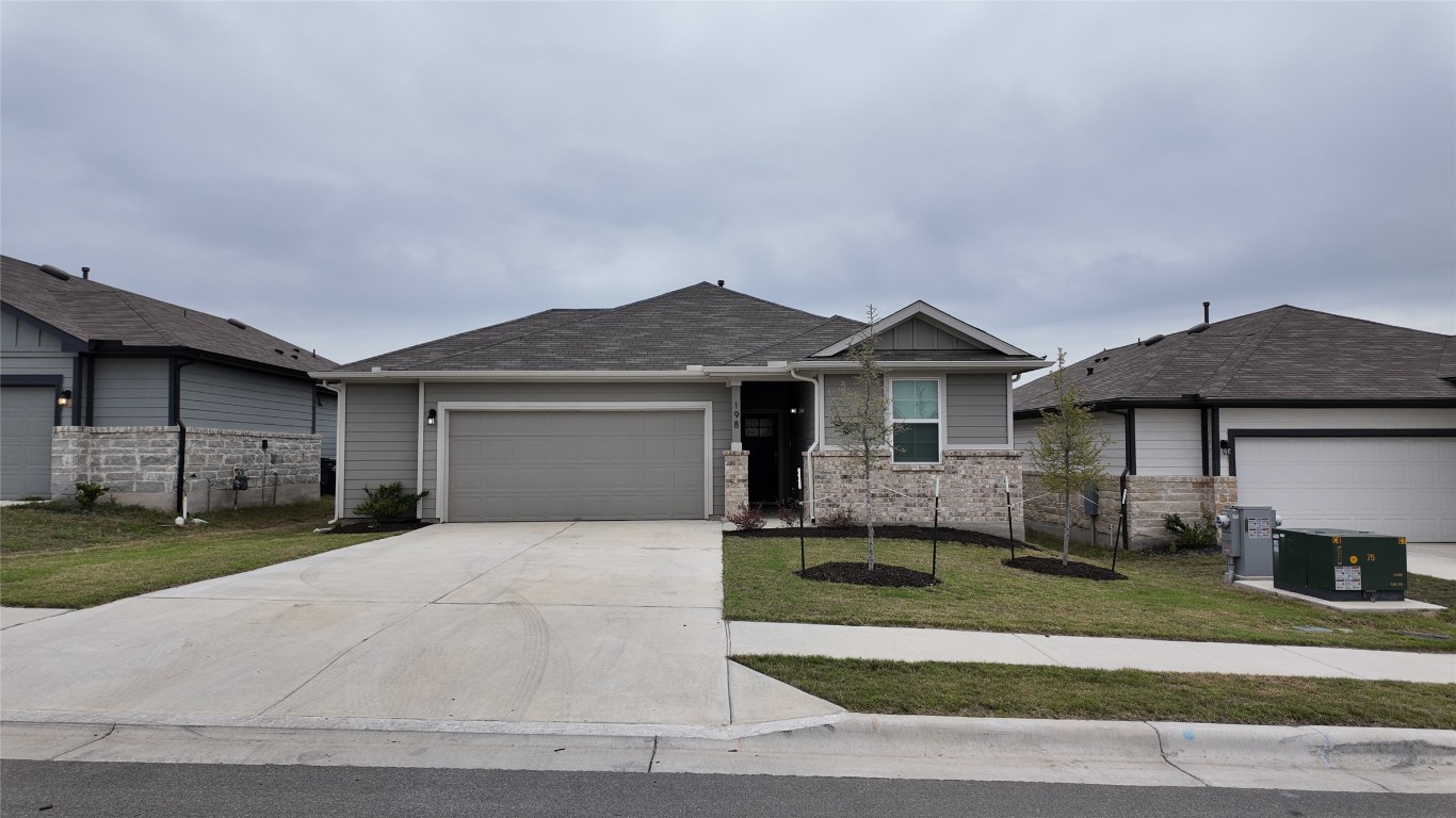 198 Greenbelt Reservoir Pass Kyle, TX 78640 - Photo 1 of 1 a front view of a house with a yard and garage