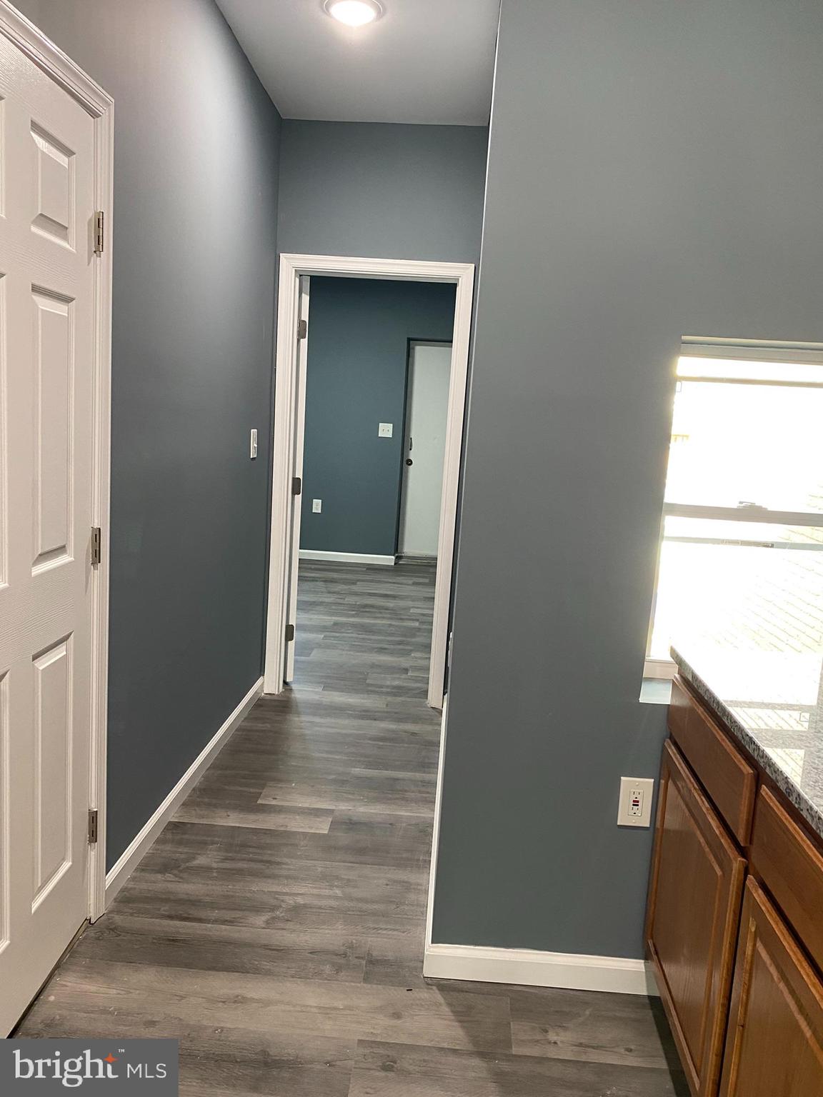 4652 York Road Baltimore, MD 21212 - Photo 14 of 20 a view of a hallway with wooden floor and staircase