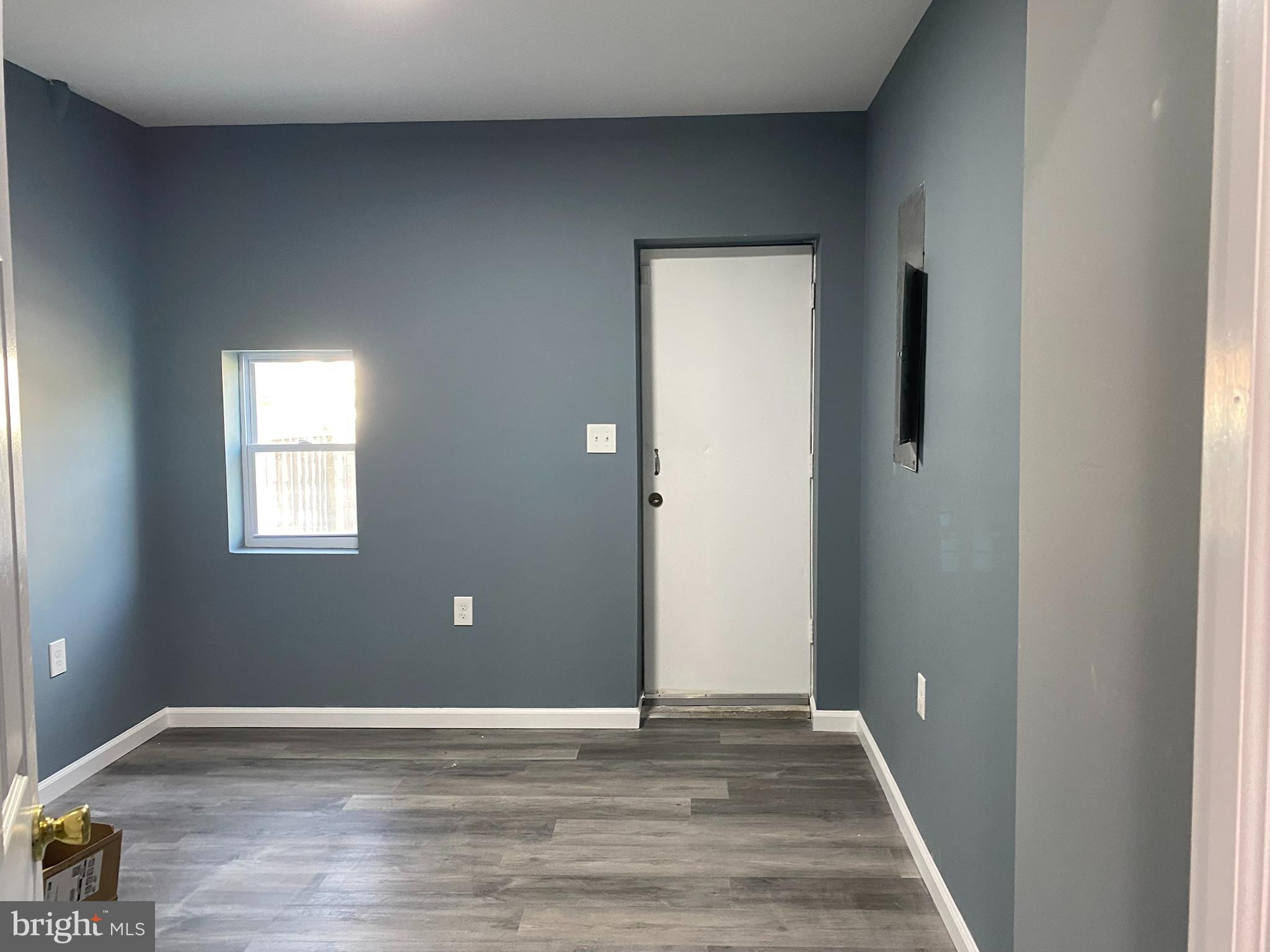 4652 York Road Baltimore, MD 21212 - Photo 17 of 20 a view of an empty room with wooden floor and a window