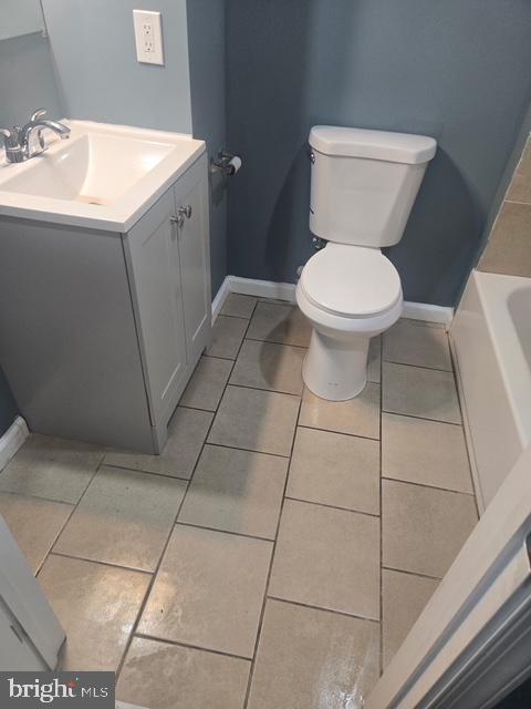 4652 York Road Baltimore, MD 21212 - Photo 9 of 20 a bathroom with a toilet sink and vanity