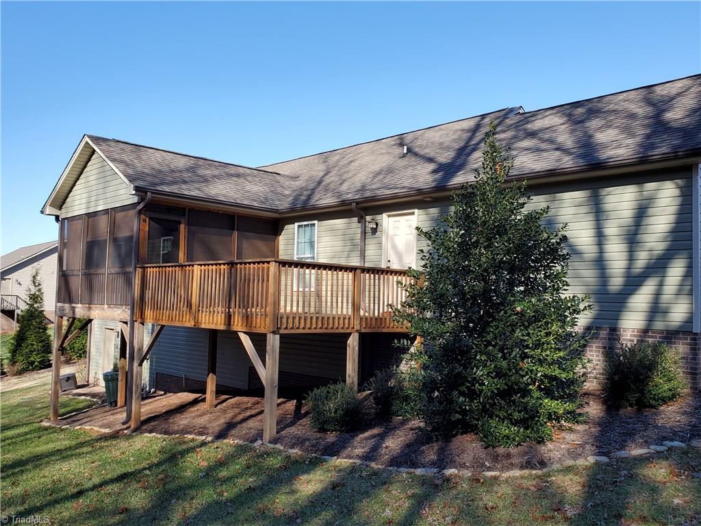 160 Campsite Road Stokesdale, NC 27357 - Photo 2 of 9 View of Screen Porch and Deck from Back Yard