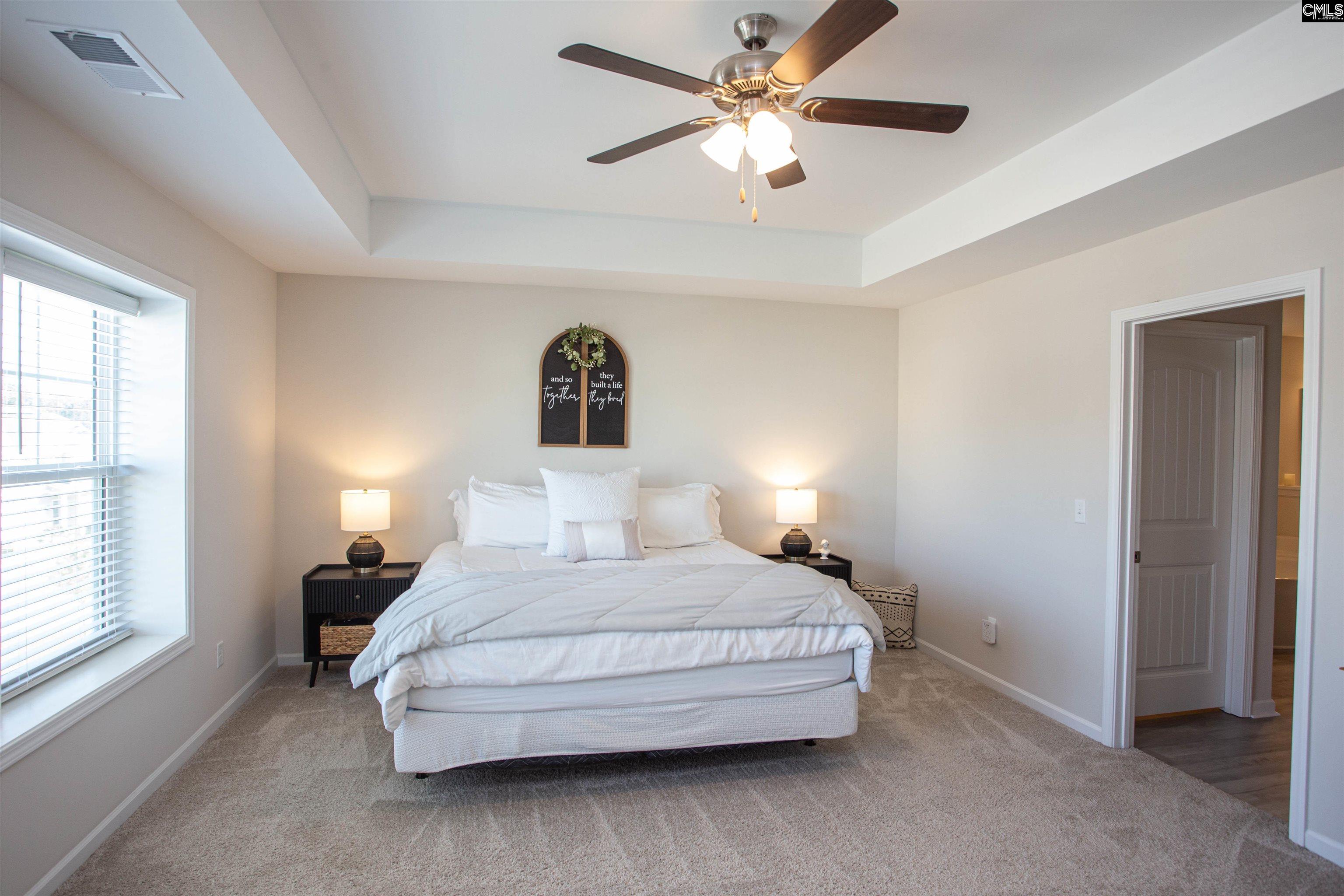 272 Shadowbrook Way Camden, SC 29020 - Photo 22 of 43 a bedroom with a bed chandelier and a window