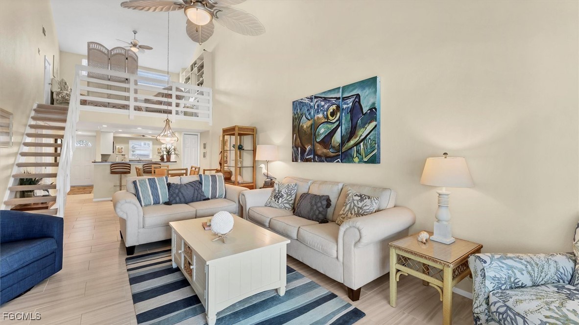 2700 North Beach Road, Unit B205 Englewood, FL 34223 - Photo 13 of 47 a living room with furniture and a lamp