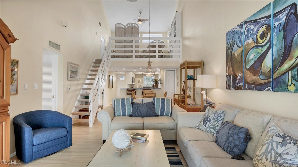 2700 North Beach Road, Unit B205 Englewood, FL 34223 - Photo 14 of 47 a living room with furniture and a painting