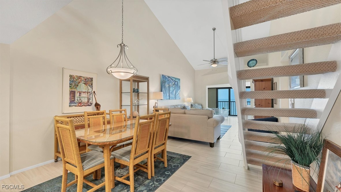 2700 North Beach Road, Unit B205 Englewood, FL 34223 - Photo 19 of 47 a view of a dining room with furniture wooden floor and a chandelier