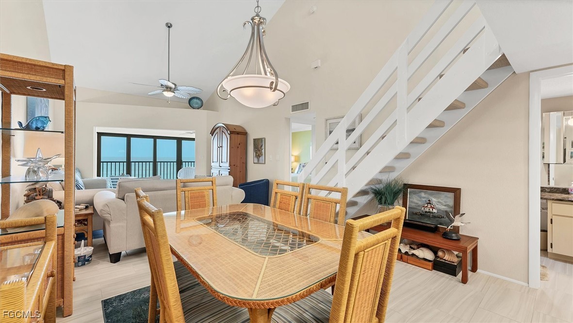 2700 North Beach Road, Unit B205 Englewood, FL 34223 - Photo 22 of 47 a view of a dining room with furniture window and wooden floor