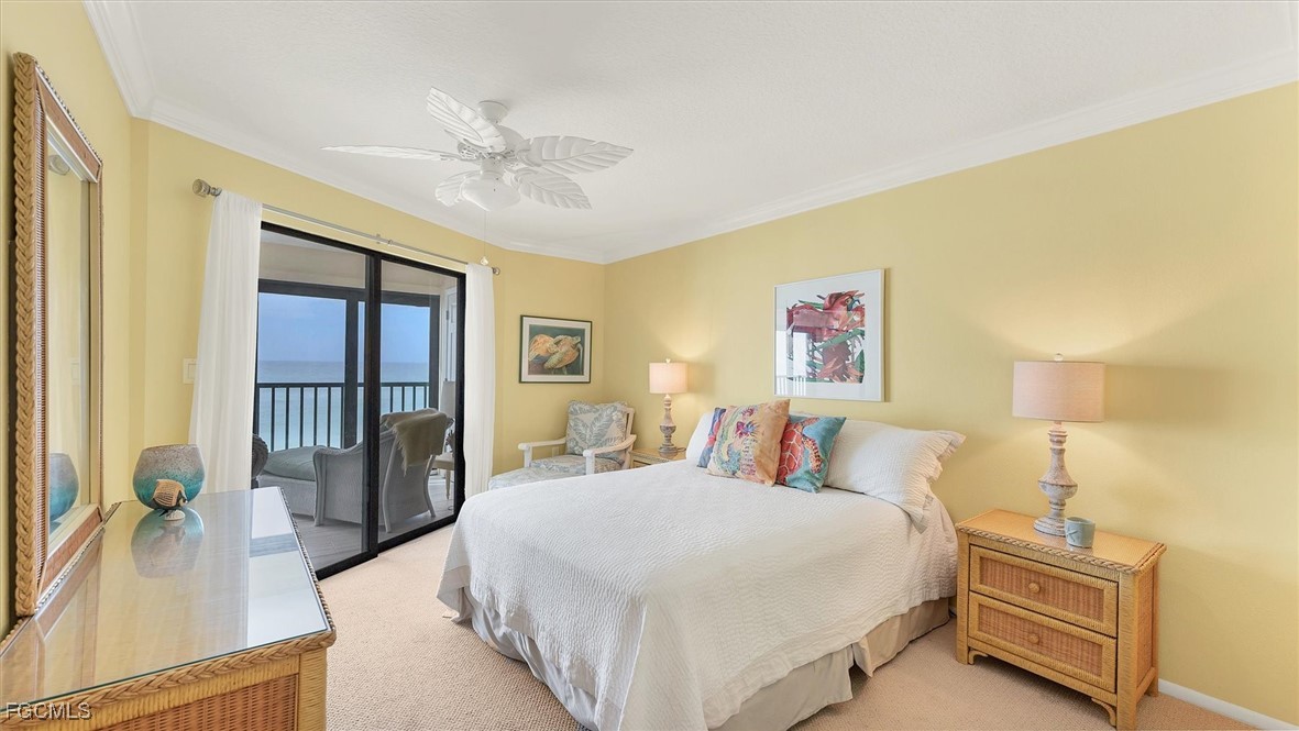 2700 North Beach Road, Unit B205 Englewood, FL 34223 - Photo 24 of 47 a spacious bedroom with a bed and a chandelier