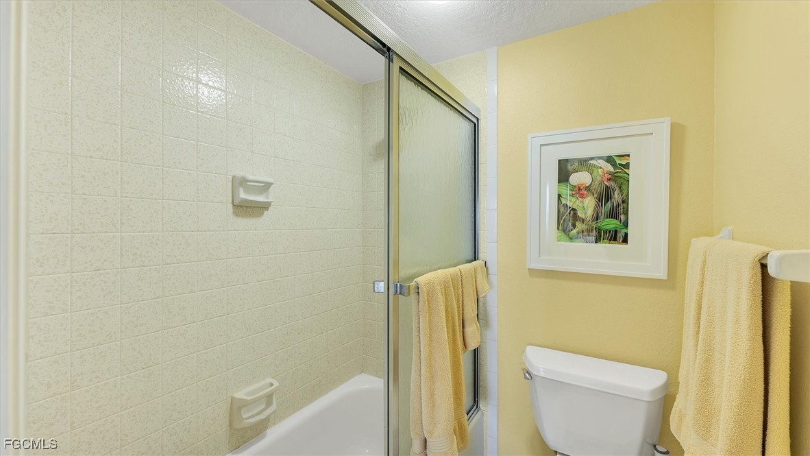2700 North Beach Road, Unit B205 Englewood, FL 34223 - Photo 27 of 47 a bathroom with a toilet and a shower