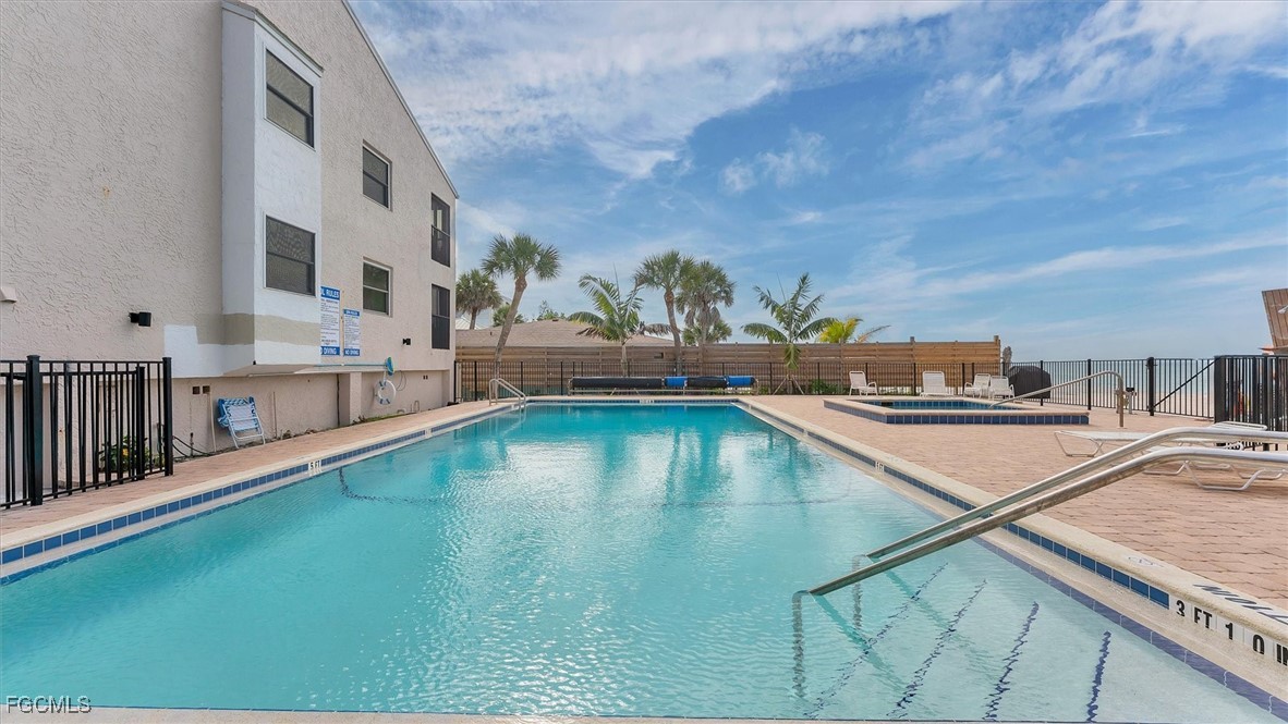 2700 North Beach Road, Unit B205 Englewood, FL 34223 - Photo 33 of 47 a view of a swimming pool with a yard