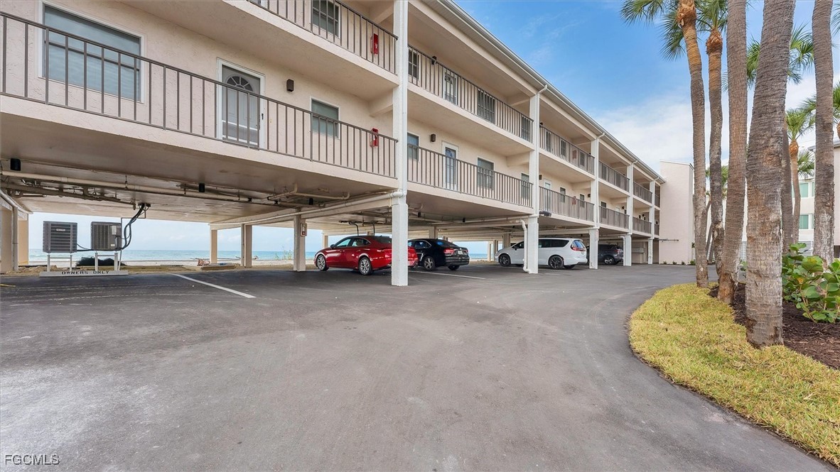 2700 North Beach Road, Unit B205 Englewood, FL 34223 - Photo 4 of 47 a car parked in front of a building