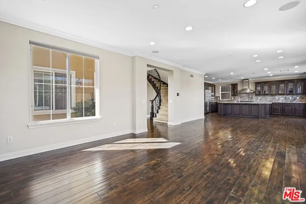 a view of a livingroom with furniture and windows