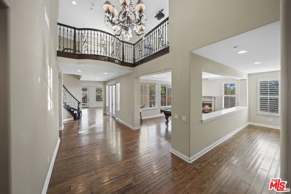 a view of an entryway with wooden floor