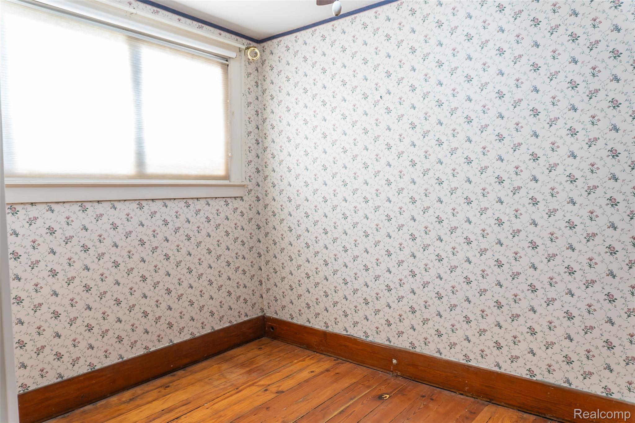 1846 North Gulley Road Dearborn, MI 48128 - Photo 17 of 32 Spare room with hardwood / wood-style floors and wallpapered walls