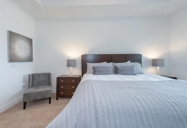 a bedroom with a bed and couch